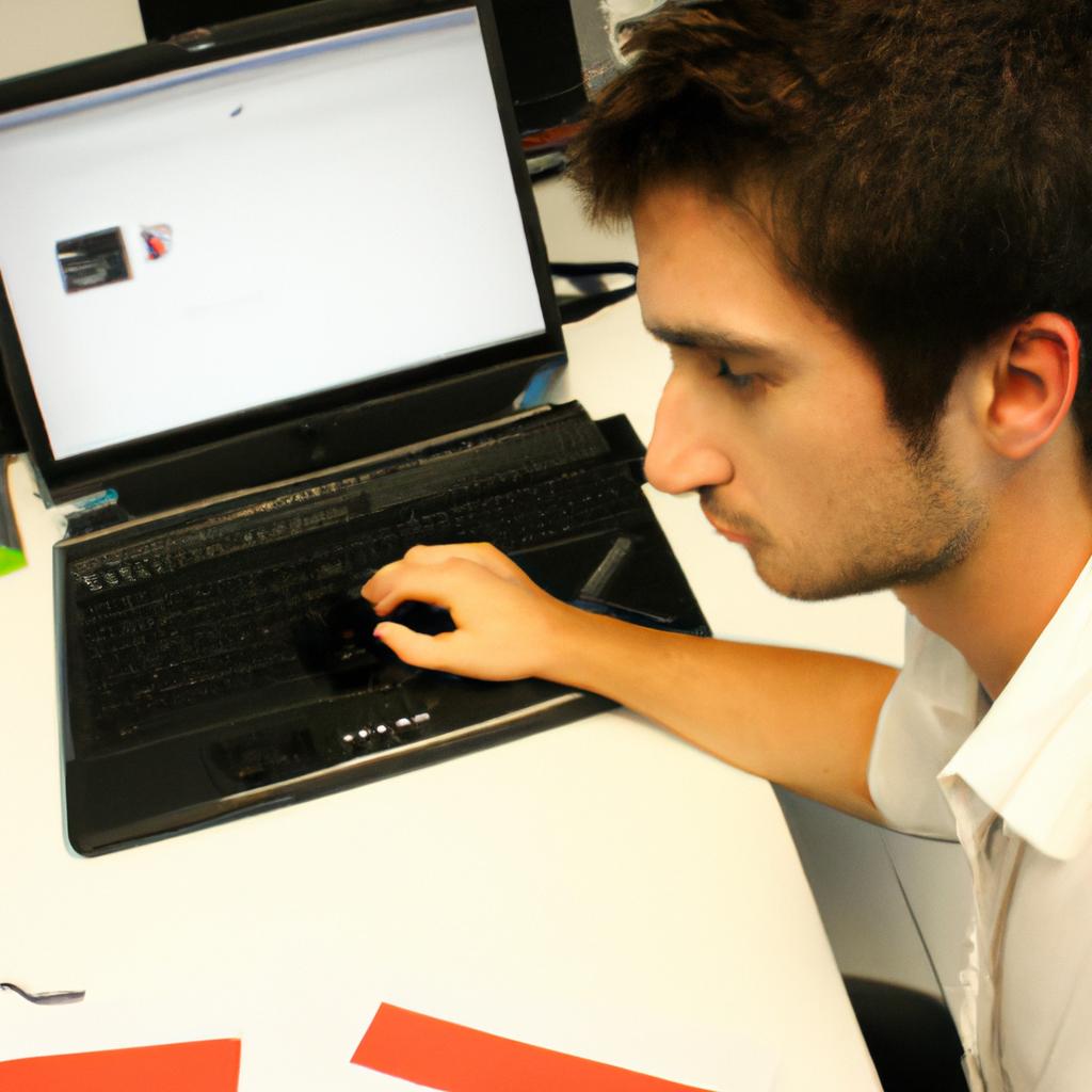 Person working with computer and files